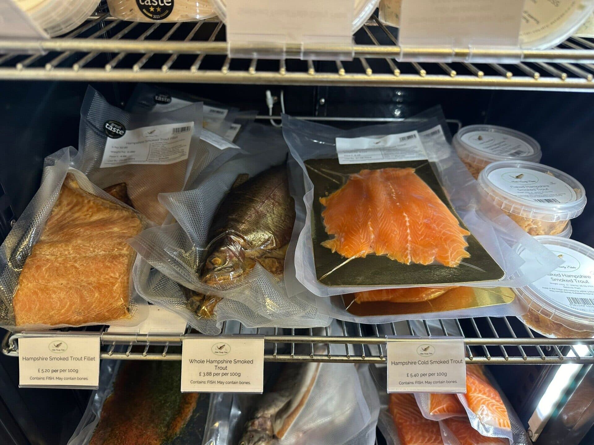 smoked trout products for sale in a shop